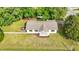 Aerial view of a charming home with a landscaped front yard and patio with a fire pit at 309 S Mckay Ave, Dunn, NC 28334