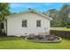 Backyard featuring a fire pit with seating and a large manicured lawn at 309 S Mckay Ave, Dunn, NC 28334