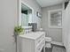 Bathroom with gray walls features a white vanity with quartz countertop at 309 S Mckay Ave, Dunn, NC 28334