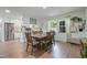 Inviting dining area with wooden table, seating for six, and bright natural light at 309 S Mckay Ave, Dunn, NC 28334