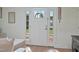 Welcoming front entryway with white door, glass panes, and stylish welcome decor at 309 S Mckay Ave, Dunn, NC 28334