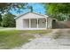 Charming home with a covered porch and white brick exterior at 309 S Mckay Ave, Dunn, NC 28334