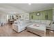 Comfortable living room features a large sectional sofa with the dining area in the background at 309 S Mckay Ave, Dunn, NC 28334