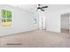 Bright and airy bedroom with large windows and neutral carpet at 325 Bluejay St, Clayton, NC 27520