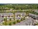 Community view showcasing townhomes near major roads with ample green space and parking at 329 Castle Rock Ln, Cary, NC 27519