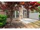 Backyard view of a screened patio perfect for outdoor relaxing with brick exterior and fresh lawn at 329 Castle Rock Ln, Cary, NC 27519