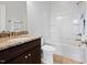 Bathroom with granite countertop vanity and shower/tub combo at 329 Castle Rock Ln, Cary, NC 27519
