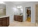 Bathroom with a granite countertop vanity and access to a walk in closet at 329 Castle Rock Ln, Cary, NC 27519