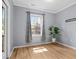 Bonus room or office space with hardwood flooring, natural light, and tree views at 329 Castle Rock Ln, Cary, NC 27519