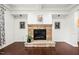 Inviting fireplace with stone surround and a raised hearth, perfect for cozy evenings at 329 Castle Rock Ln, Cary, NC 27519