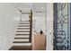 Elegant foyer with hardwood floors and an open staircase leading to the upper level at 329 Castle Rock Ln, Cary, NC 27519