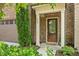Inviting front entrance with a decorative glass door and well-kept landscaping at 329 Castle Rock Ln, Cary, NC 27519