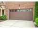 Spacious two-car garage with a carriage-style door and ample driveway space at 329 Castle Rock Ln, Cary, NC 27519
