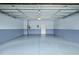 Clean, spacious garage with painted walls, sealed floors, and a single door for easy access at 329 Castle Rock Ln, Cary, NC 27519