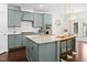 Bright eat-in kitchen features granite countertops, stainless appliances and a breakfast bar with seating at 329 Castle Rock Ln, Cary, NC 27519