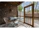 Charming screened-in porch with string lights, a brick wall, and cozy seating perfect for relaxing at 329 Castle Rock Ln, Cary, NC 27519
