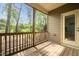 Enjoy nature in this cozy screened porch with a wooden floor, a screened enclosure, and lovely nature views at 329 Castle Rock Ln, Cary, NC 27519