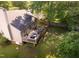 A home featuring a deck with grill & seating, a fenced yard, mature trees and a well-maintained lawn at 358 Tillamook Dr, Wake Forest, NC 27587