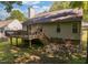 Backyard view showing a large deck and the exterior of the home at 358 Tillamook Dr, Wake Forest, NC 27587
