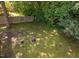 A well-maintained backyard with a fire pit and mature trees, perfect for outdoor gatherings and relaxation at 358 Tillamook Dr, Wake Forest, NC 27587
