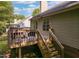 Exterior view of the home's backyard with a deck and stair access at 358 Tillamook Dr, Wake Forest, NC 27587