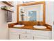 Close-up view of a bathroom featuring double sinks and wood countertop at 358 Tillamook Dr, Wake Forest, NC 27587