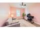 Cozy bedroom with pink walls and a comfortable futon sofa at 358 Tillamook Dr, Wake Forest, NC 27587