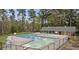 Large community pool with ample seating and a diving board, perfect for relaxing and soaking up the sun at 358 Tillamook Dr, Wake Forest, NC 27587