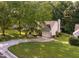 A charming home with a well-manicured lawn, mature trees and a welcoming front porch, offering curb appeal at 358 Tillamook Dr, Wake Forest, NC 27587