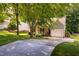 Inviting home featuring a well-maintained lawn, mature trees, and a spacious driveway, creating a warm welcome at 358 Tillamook Dr, Wake Forest, NC 27587