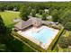 Overhead view of a community pool and clubhouse, highlighting the outdoor recreational amenities in a residential area at 3587 Garner Terrace Way, Wake Forest, NC 27587