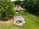 Aerial view showcasing a community playground and clubhouse with a lush green lawn and surrounding trees at 3587 Garner Terrace Way, Wake Forest, NC 27587