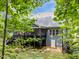 Secluded backyard featuring a large deck, screened porch, and mature trees at 3587 Garner Terrace Way, Wake Forest, NC 27587