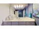 Stylish bathroom with a swan decoration, a large mirror, soft lighting, and modern fixtures creating a spa-like feel at 3587 Garner Terrace Way, Wake Forest, NC 27587