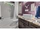 Stylish bathroom with modern fixtures, granite countertop, and a combined shower and tub at 3587 Garner Terrace Way, Wake Forest, NC 27587