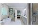 A spacious primary bathroom features a soaking tub, marble floors, and double vanity at 3587 Garner Terrace Way, Wake Forest, NC 27587
