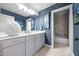 Stylish bathroom featuring a double vanity, framed mirrors and a tiled shower-tub combo at 3587 Garner Terrace Way, Wake Forest, NC 27587