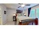 A comfortable bedroom features a wooded bed frame, art, and windows at 3587 Garner Terrace Way, Wake Forest, NC 27587
