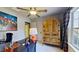A home office/bedroom features ample natural light, a ceiling fan, and a cabinet at 3587 Garner Terrace Way, Wake Forest, NC 27587