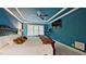 Large primary bedroom with trey ceiling, ceiling fan, and a large window at 3587 Garner Terrace Way, Wake Forest, NC 27587