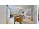 A bright bonus room features a foosball table, couch, and a mini-fridge at 3587 Garner Terrace Way, Wake Forest, NC 27587