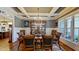 Formal dining room with coffered ceiling, chandelier and beautiful wood floors at 3587 Garner Terrace Way, Wake Forest, NC 27587