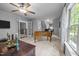 Spacious game room with a foosball table, ceiling fan, and staircase at 3587 Garner Terrace Way, Wake Forest, NC 27587