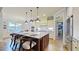 Spacious kitchen with granite counters, center island, and pendant lighting at 3587 Garner Terrace Way, Wake Forest, NC 27587