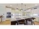 Bright kitchen featuring a large center island and white cabinetry at 3587 Garner Terrace Way, Wake Forest, NC 27587