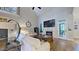 Living room features a fireplace, hardwood floors, and lots of natural light at 3587 Garner Terrace Way, Wake Forest, NC 27587