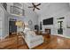 Bright living room featuring high ceilings, fireplace, hardwood floors, and modern decor at 3587 Garner Terrace Way, Wake Forest, NC 27587