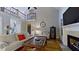 Bright living room with fireplace, hardwood floors, and an open, airy design at 3587 Garner Terrace Way, Wake Forest, NC 27587