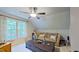 Comfortable living room features a couch, large windows, and a coffee table at 3587 Garner Terrace Way, Wake Forest, NC 27587