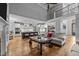 Open living space with kitchen island, hardwood floors, and great natural light from large windows at 3587 Garner Terrace Way, Wake Forest, NC 27587